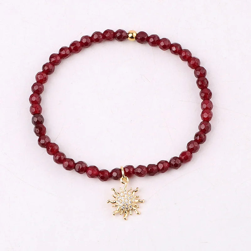 【Ruby】ソルベトーンクォーツのゴムブレスレット The Solstice Bracelet | Natural Red Jade & CZ Sun Charm – Pretty