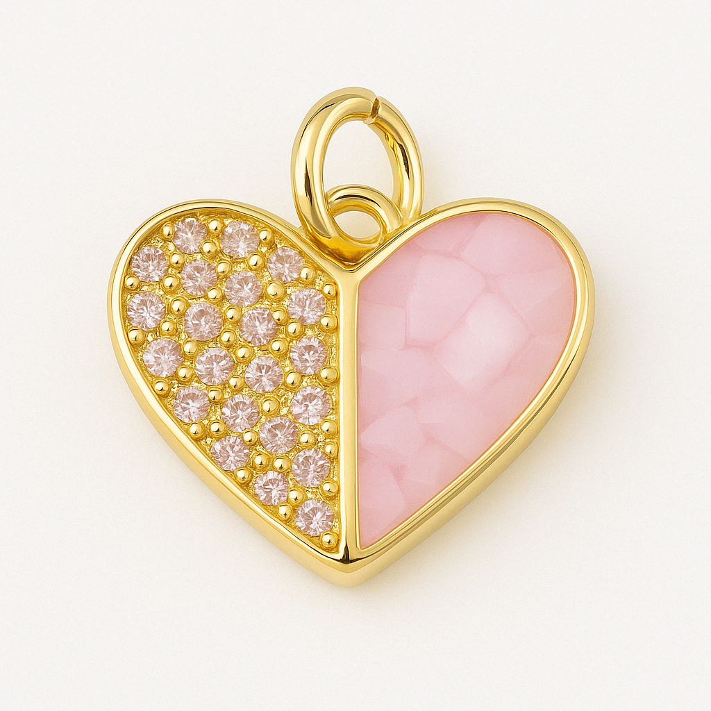 Gold heart-shaped charm featuring one half with pink gemstones in a pave setting and the other half with a pink mosaic inlay, styled on a clean white background.