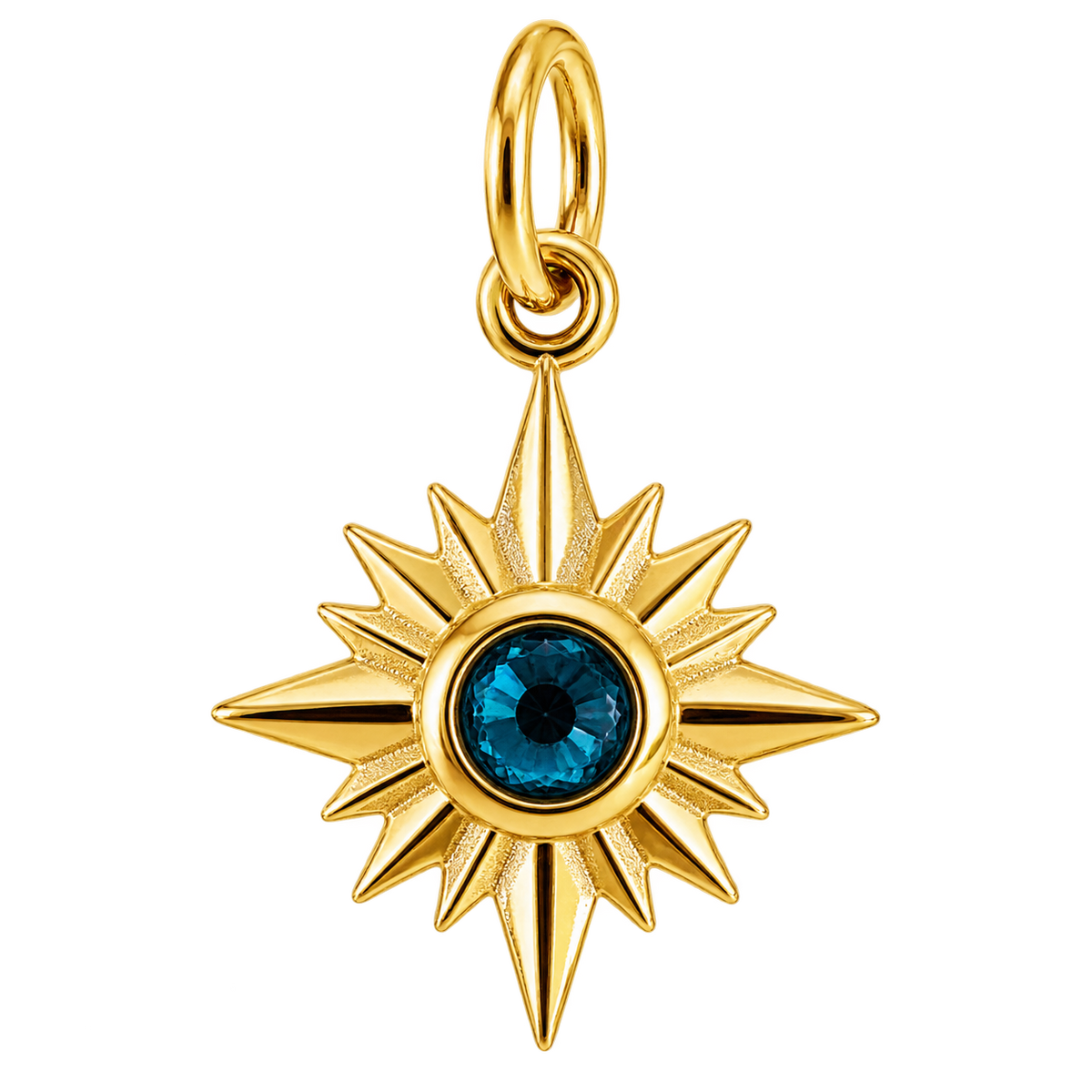Gold-tone compass starburst charm with deep blue crystal center