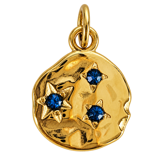 Organic gold-tone disc charm with three deep-blue crystal stars