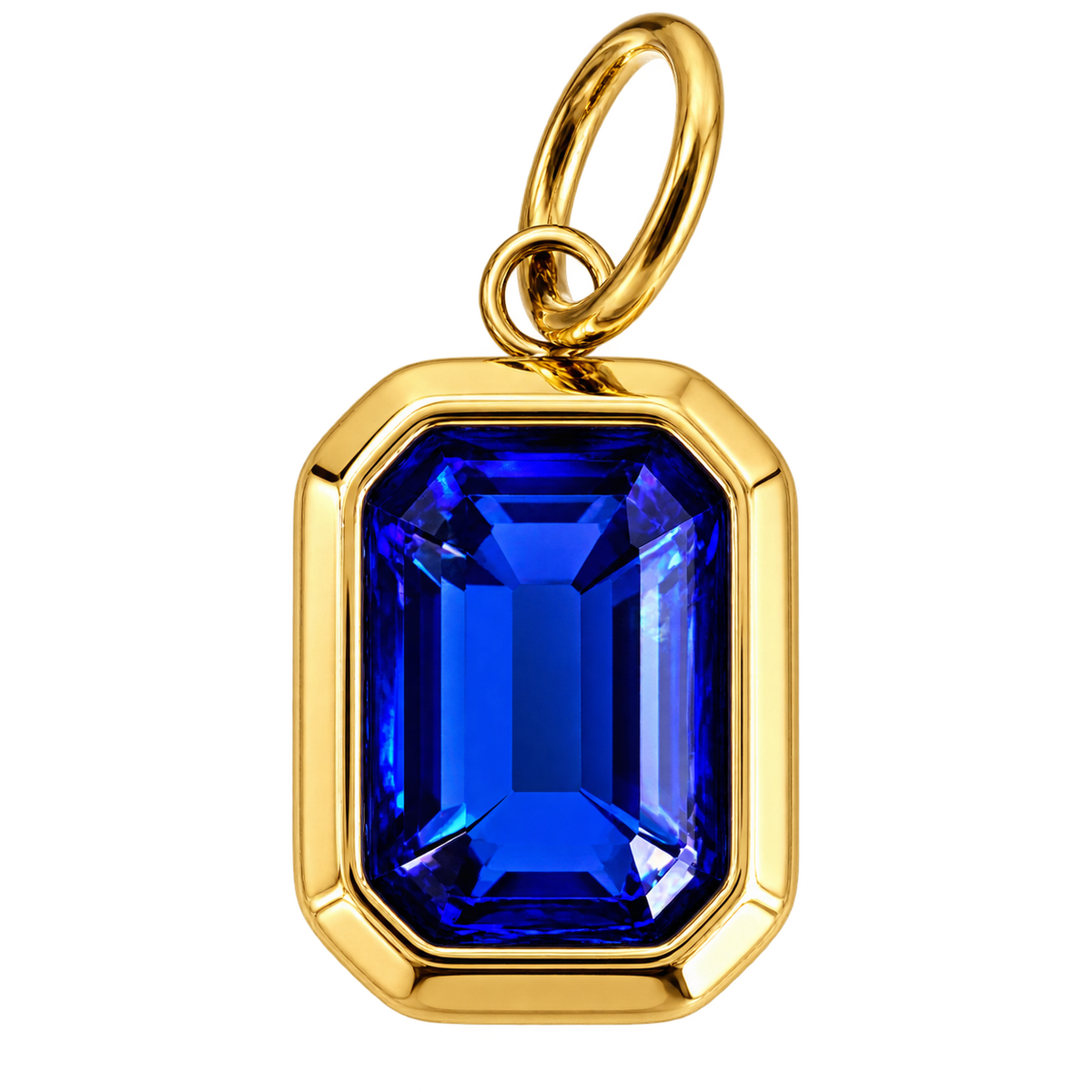 Rectangular gold-tone charm with faceted cobalt-blue gemstone