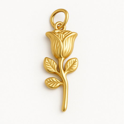 Gold rose charm pendant with detailed petals and leaves, photographed on a white background.