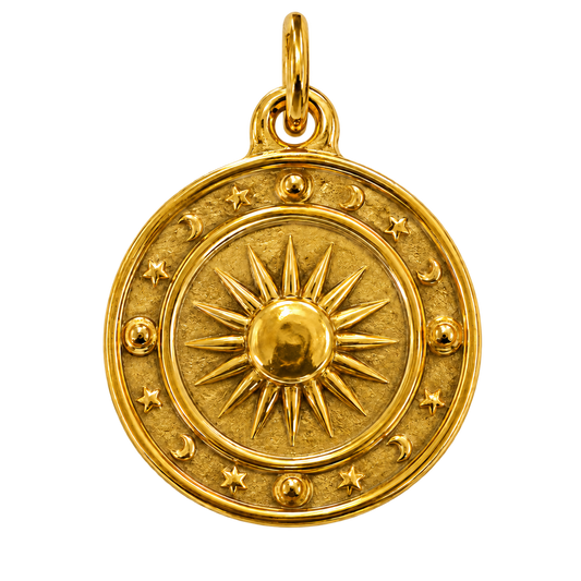 Gold-tone celestial medallion charm with raised sun, moons and stars