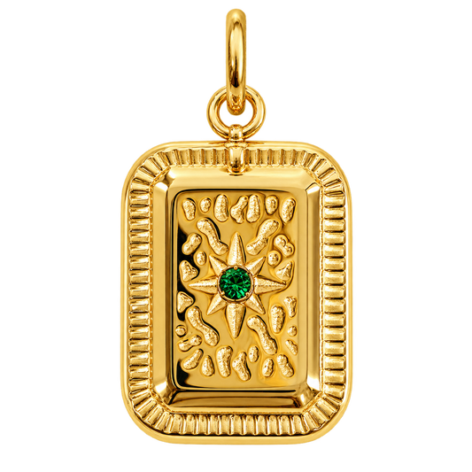Rectangular gold-tone tablet charm with green starburst center
